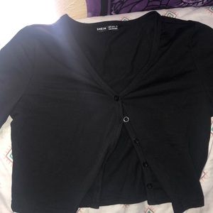 A black button down cropped top